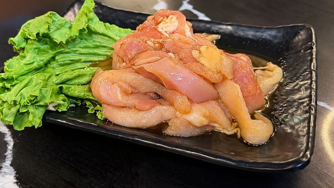 Chicken Bulgogi — marinated chicken served raw for the table grill