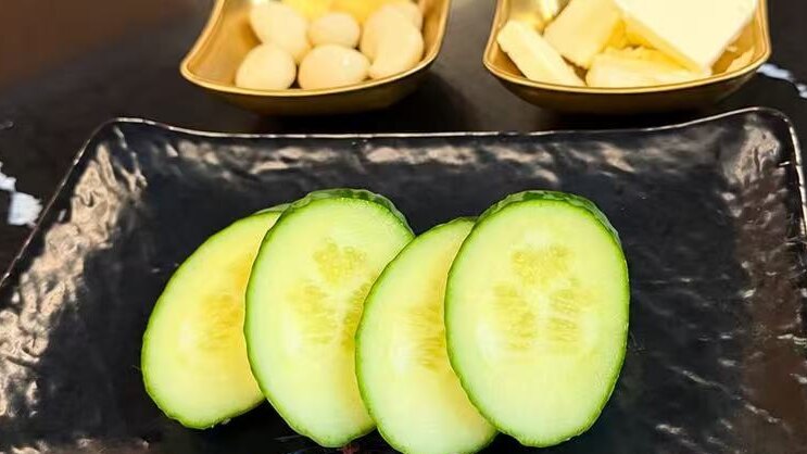 Garlic, butter and cucumber served alongside the grill
