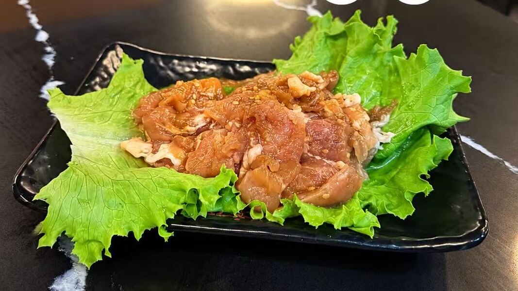 Pork Bulgogi — marinated pork served raw for the table grill